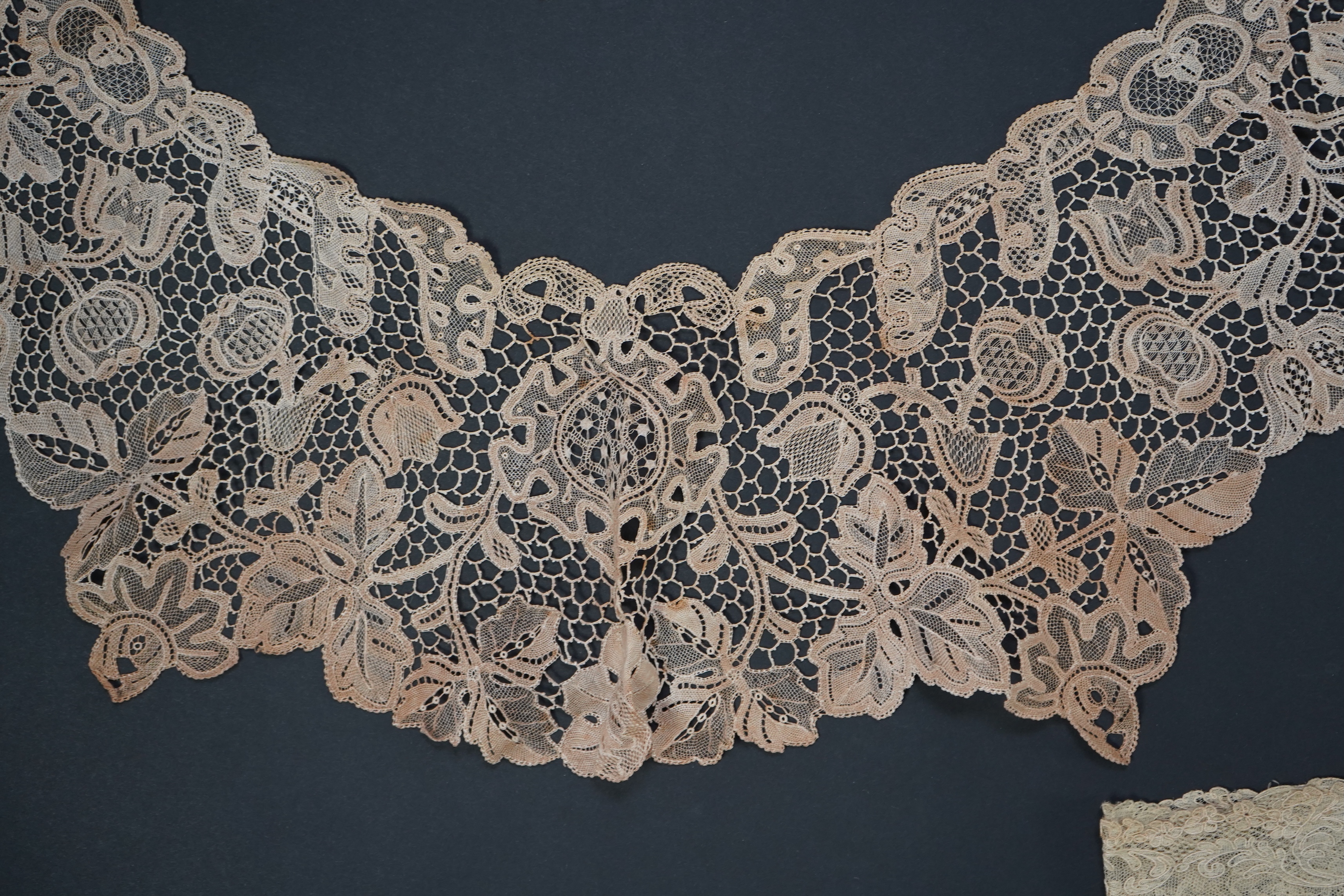 A variety of 19th and 20th century cream lace, being mixed hand and machine collars, lappets, trimmings together with a silk stole. Ideal for tv, film and theatre, stole 230 cm long. Condition - good